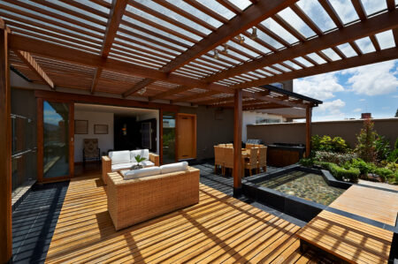 An Outdoor Living room with wooden Roof